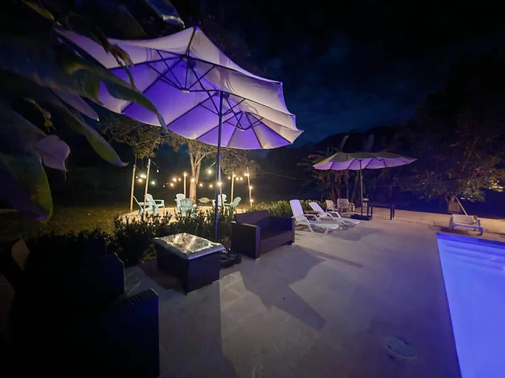 Pool furniture at night - Villas La Paillote Boutique Villas near Playa Tambor, Paquera